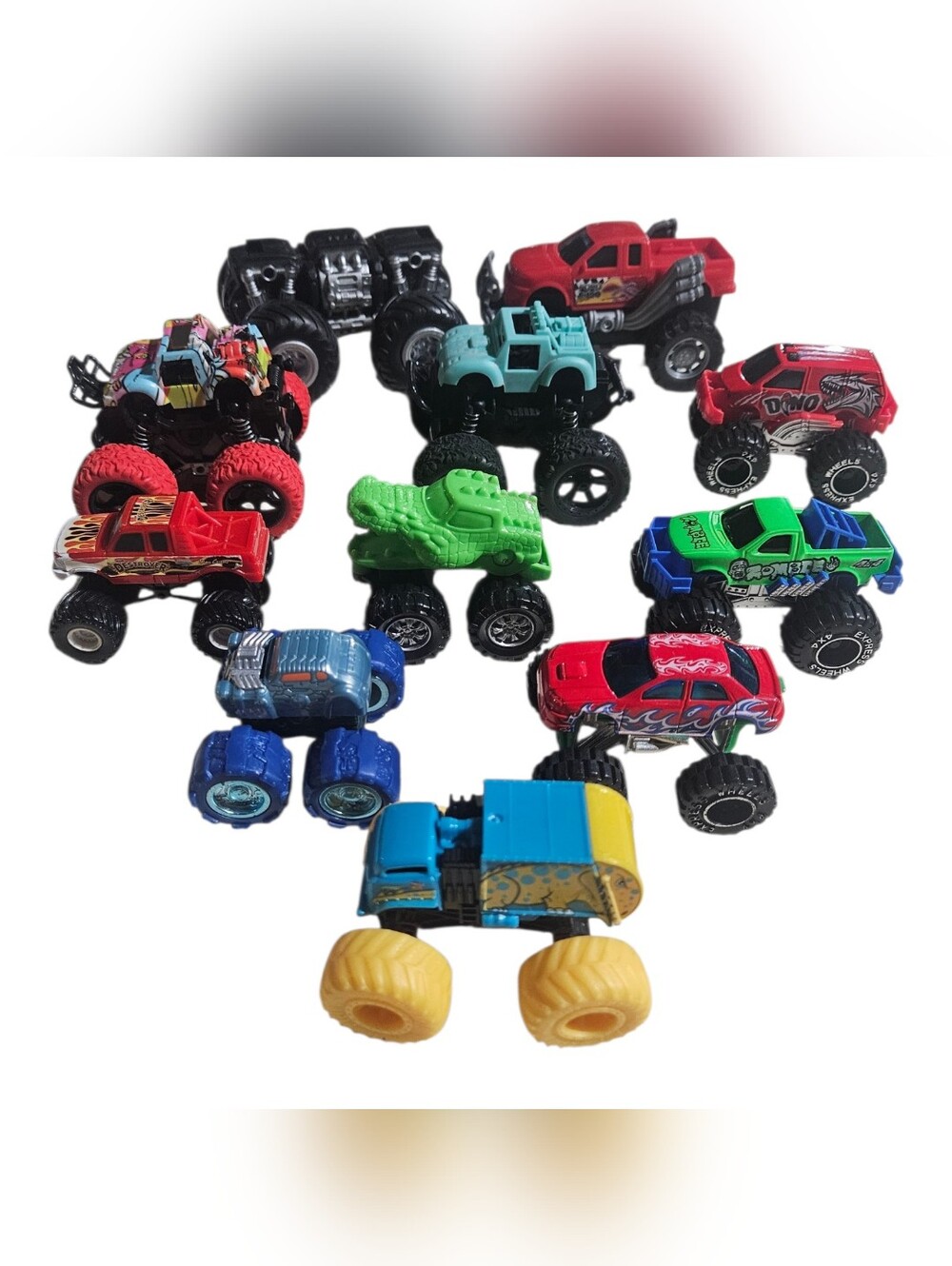 Miscellaneous Lot 0f 11 Plastic Monster Truck Toys Some Are Pull Back & Go